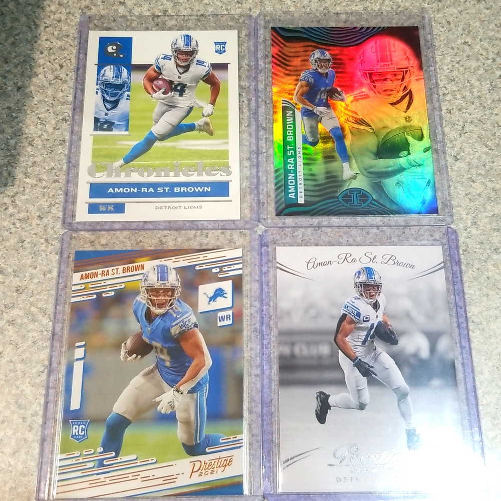 4 card Amon Ra St Brown lot.